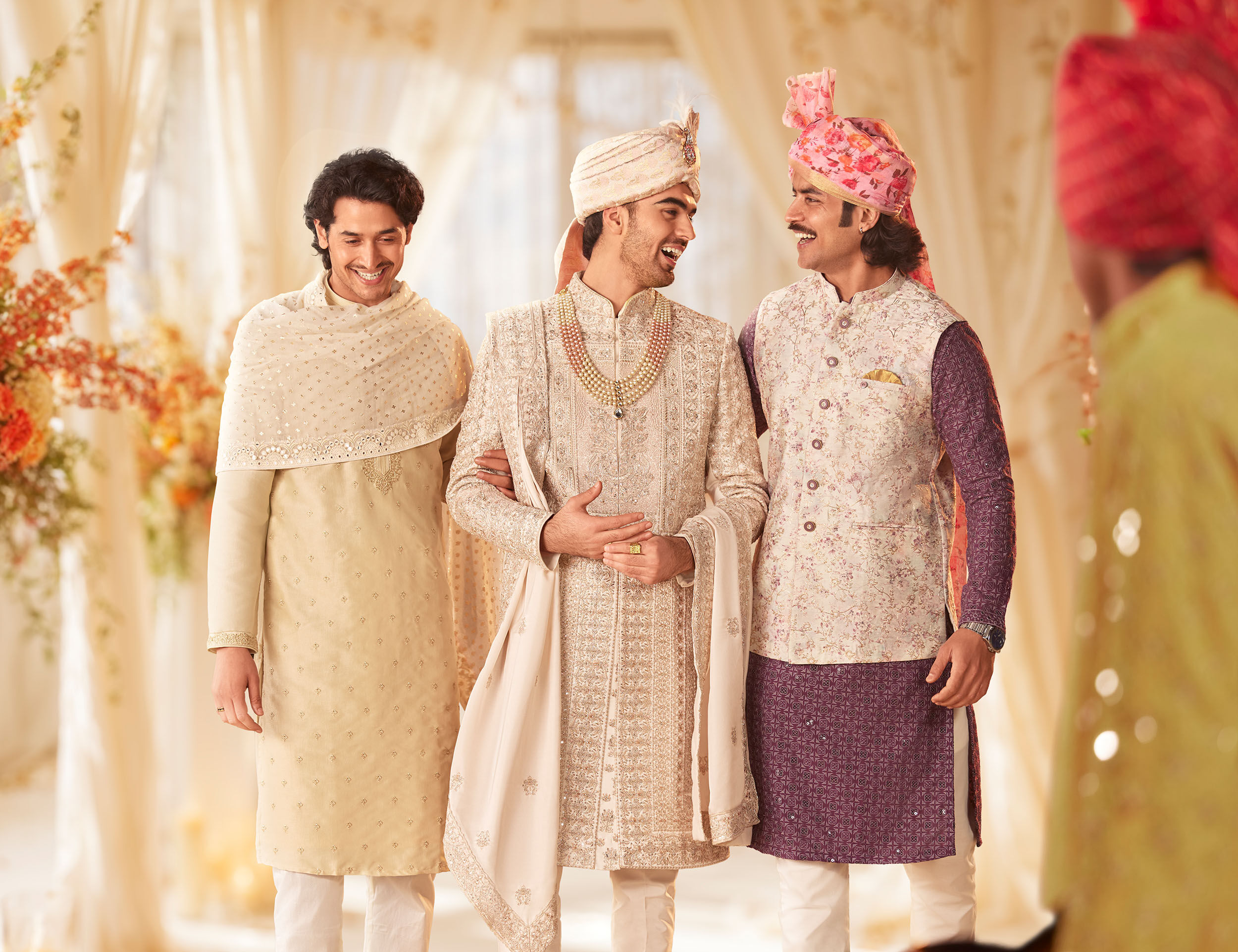 Groom wearing elegant sherwani and safa and walking with freinds